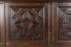 An impressive early 18th century Dutch oak geometric kussen cabinet secretaire