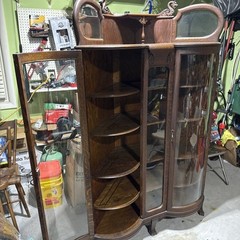 Antique Tiger Oak Corner Curio Cabinet. Ornate details, curved glass doors.