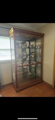 Howard Miller Parkview Curio Cabinet (Cherry Bordeaux Finish)