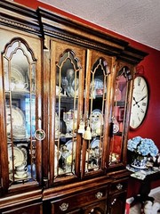 Elegant wooden china cabinet with glass doors and ample storage. 61” wide Brass