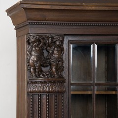 20th Century Danish Oak Display Cabinet with Carved Putti and Beveled Glass