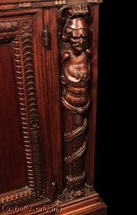 SUPERB WALNUT CARVED FIGURAL CABINET WITH HUTCH. WOW!!!