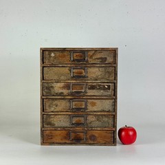 Antique Six Drawers Desktop Office Cabinet With Remnant Embossed Paper Over Wood