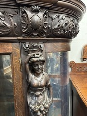 A. J. JOHNSON CARVED OAK CHINA CABINET