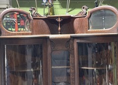 Antique Tiger Oak Corner Curio Cabinet. Ornate details, curved glass doors.