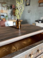 Rustic three-drawer nightstand blends seamlessly into a western-styled home.