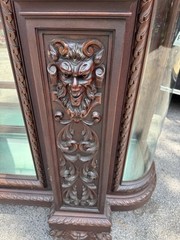 ORIEL CABINET CO. CARVED MAHOGANY MAN FIGURE CHINA CABINET