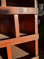 vintage hardware store cubby hole cabinet Old orange paint 109” X 54.5 X 10 3/8