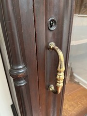 antique display cabinet with beveled glass door