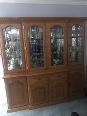 Oak china cabinet with beveled glass doors,lighted mirrors.Great condition! 