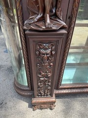 ORIEL CABINET CO. CARVED MAHOGANY MAN FIGURE CHINA CABINET