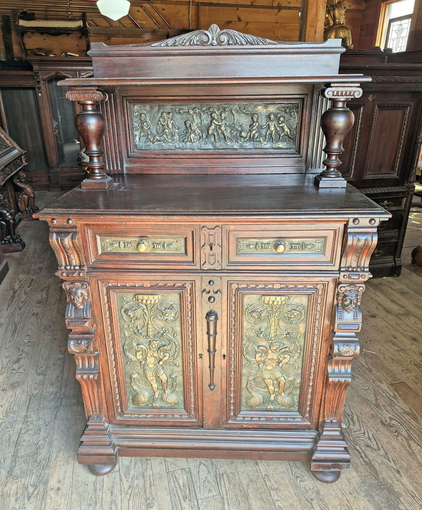 VICTORIAN OAK CABINET W FIGURAL BRASS PANELS