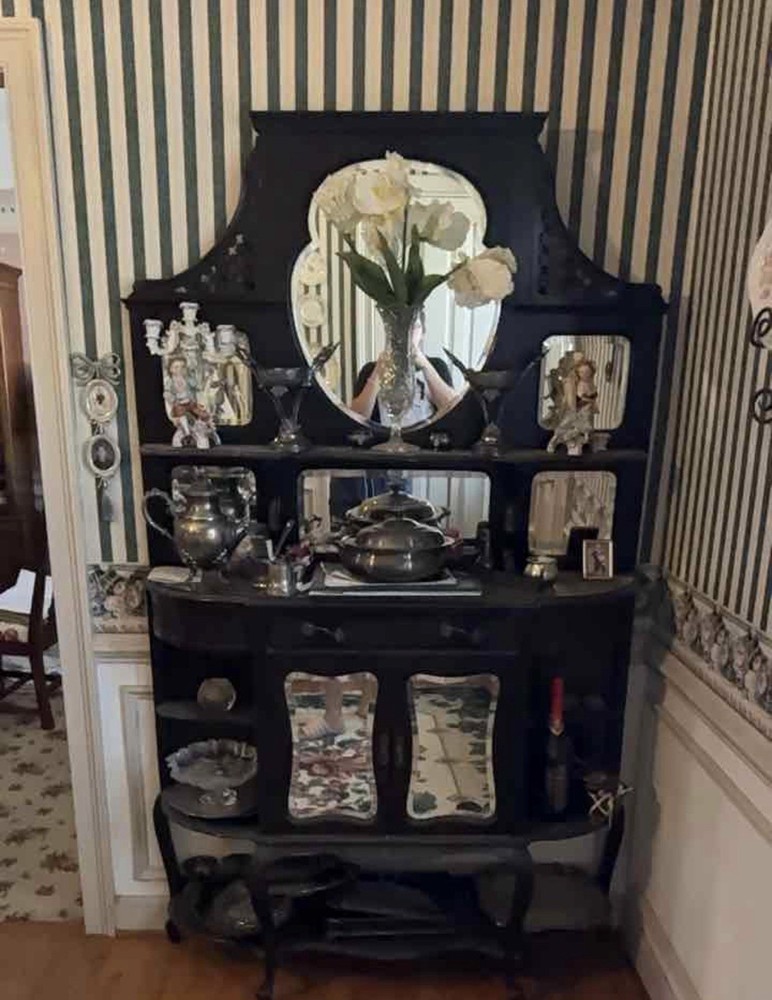 Victorian ebonized mahogany chiffonier with mirrored back and decorative carving