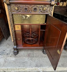 R.J. HORNER CARVED GRIFFIN LIQUOR BAR CABINET