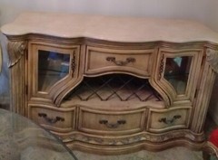 French provincial beige buffet table with inset lighting and wine wreck