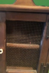 Vintage Or Antique Rustic Wooden Cabinet with A Wire Mesh Door. Very Nice