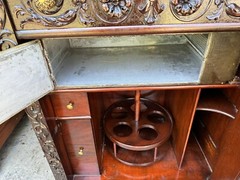 R.J. HORNER CARVED GRIFFIN LIQUOR BAR CABINET