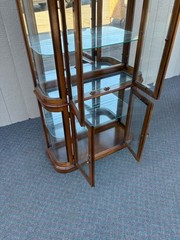 67590 Pulaski Lighted Curio Cabinet with Bowed Glass Doors