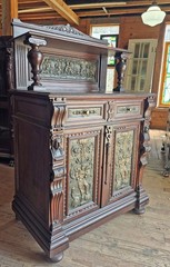 VICTORIAN OAK CABINET W FIGURAL BRASS PANELS