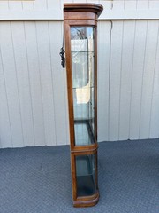 67589 Pulaski Lighted Curio Cabinet with Bowed Glass Doors