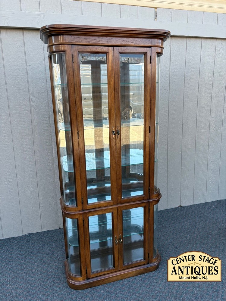 67590 Pulaski Lighted Curio Cabinet with Bowed Glass Doors