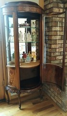 vintage antique curved glass curio cabinet circa 1930s in excellent condition.