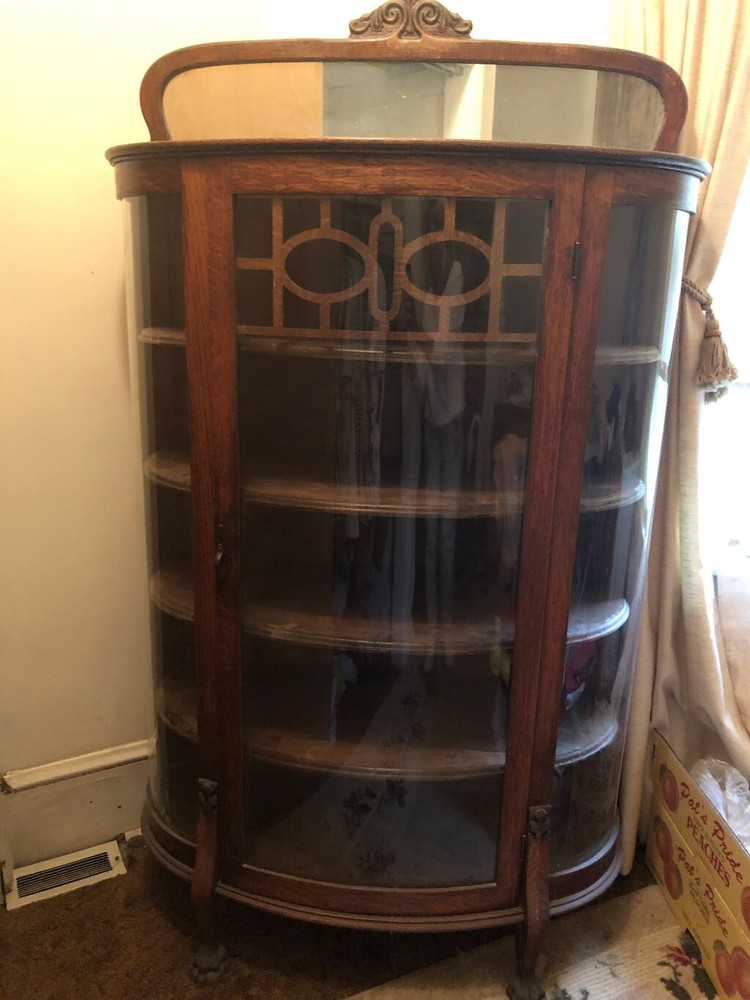 Antique China Cabinet with curved glass and clawed feet !
