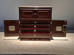 AN UNUSUAL MINIATURE CARVED WOOD APPRENTICE CABINET