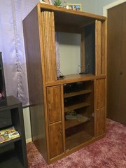 Vintage wooden entertainment center or display cabinet. Oak. Working tambour.