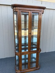 67589 Pulaski Lighted Curio Cabinet with Bowed Glass Doors