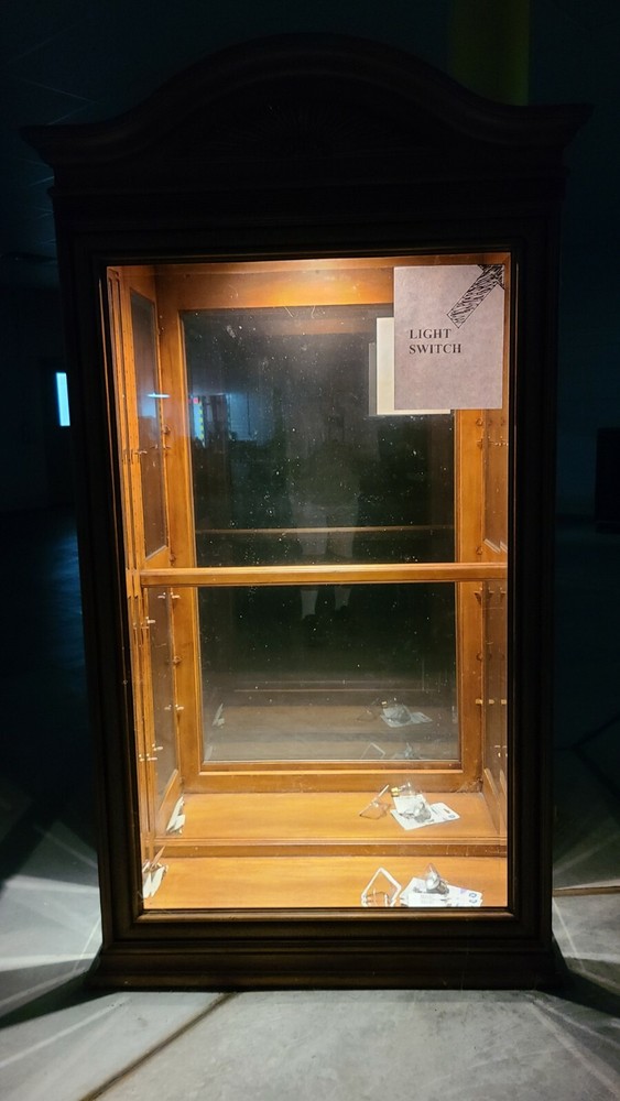 used lighted curio cabinet glass with bevel edge around the glass