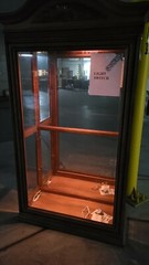 used lighted curio cabinet glass with bevel edge around the glass