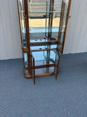 67589 Pulaski Lighted Curio Cabinet with Bowed Glass Doors