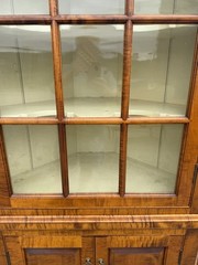 DR Dimes corner cupboard in strong tiger maple for Colonial Williamsburg.