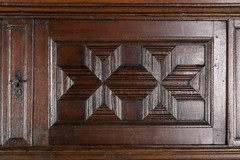 An impressive early 18th century Dutch oak geometric kussen cabinet secretaire