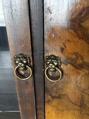 This Is an Asian walnut china cabinet, likely dating from the 1920s to 1930s. I
