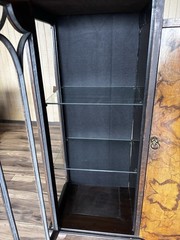 This Is an Asian walnut china cabinet, likely dating from the 1920s to 1930s. I