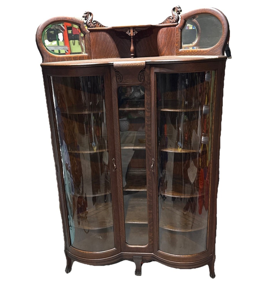 Antique Tiger Oak Corner Curio Cabinet. Ornate details, curved glass doors.