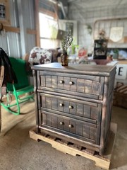 Rustic three-drawer nightstand blends seamlessly into a western-styled home.