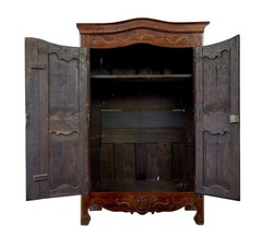 18TH CENTURY CARVED FRENCH YEW AND CHESTNUT ARMOIRE