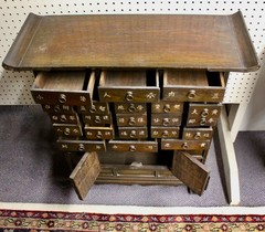 Antique Asian Wooden Apothecary Cabinet: 21 Drawers, 2-Door Cabinet, Brass Pulls
