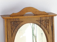 Small Antique Wooden Hanging Cabinet with Oval Mirror and Carved Floral Details