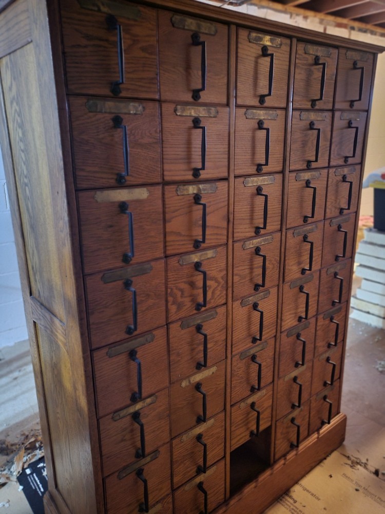 Antique, solid oak card catalog cabinet with 40 individual drawers