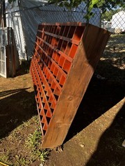 vintage hardware store cubby hole cabinet Old orange paint 109” X 54.5 X 10 3/8