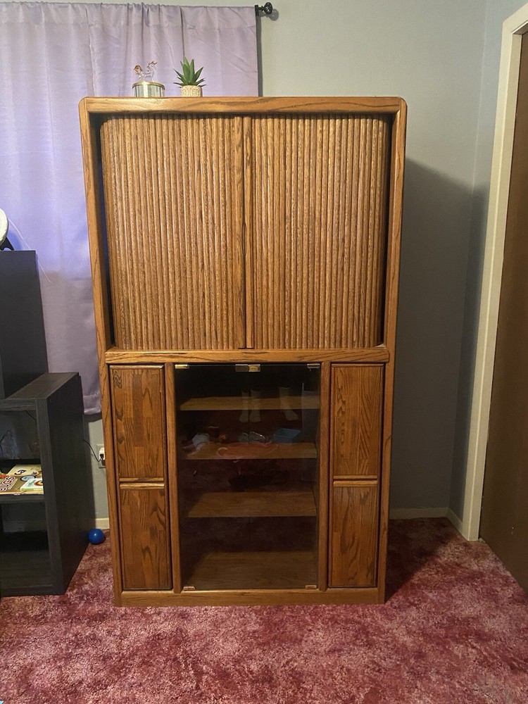 Vintage wooden entertainment center or display cabinet. Oak. Working tambour.