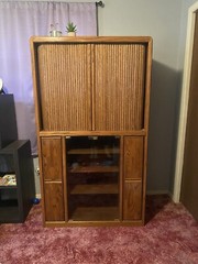 Vintage wooden entertainment center or display cabinet. Oak. Working tambour.