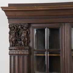 20th Century Danish Oak Display Cabinet with Carved Putti and Beveled Glass