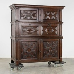 An impressive early 18th century Dutch oak geometric kussen cabinet secretaire