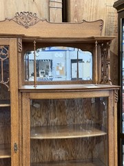 Antique Oak Display Cabinet with Carved Details and Curved Glass