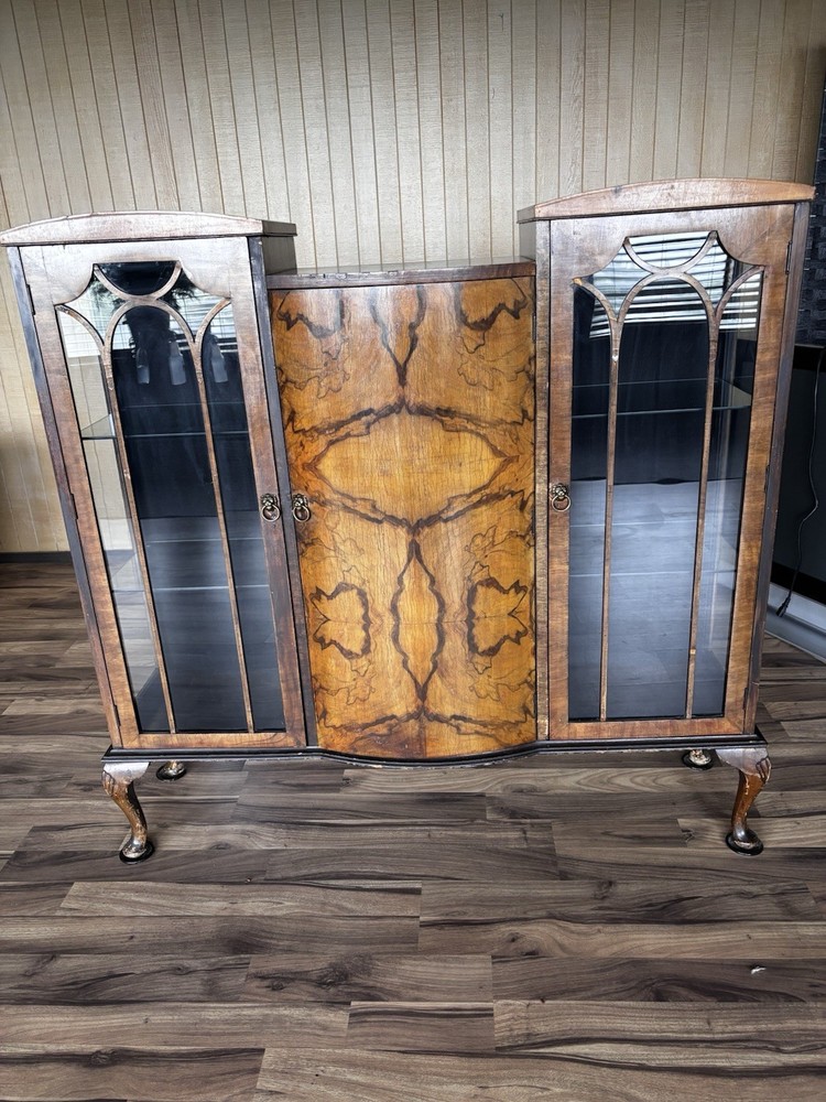 This Is an Asian walnut china cabinet, likely dating from the 1920s to 1930s. I